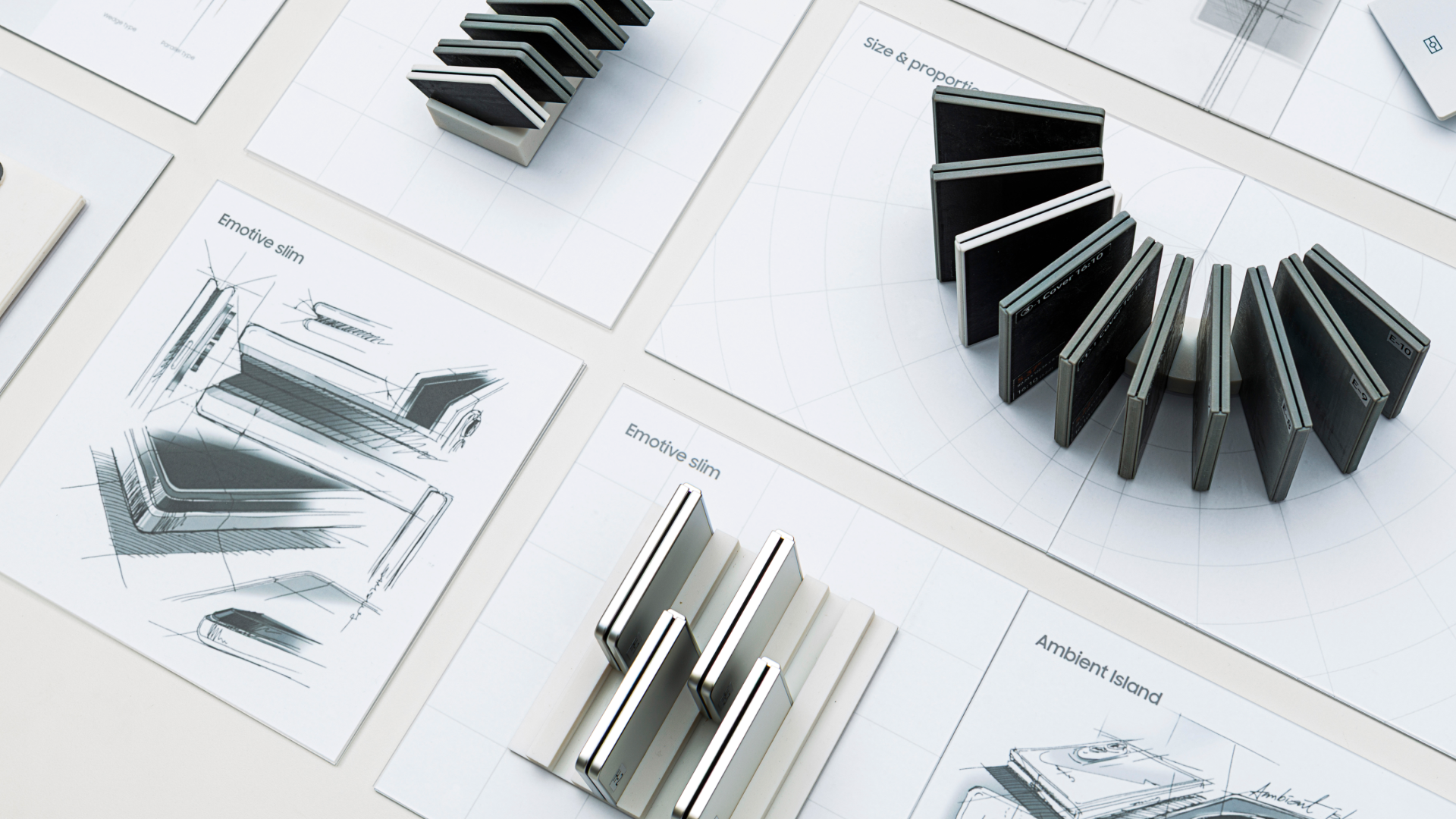 Product design development process image featuring multiple sketch sheets and 3D prototype models laid out on a white surface. The design concepts labeled include 'Emotive slim', 'Size & Proportion', and 'Ambient Island'.