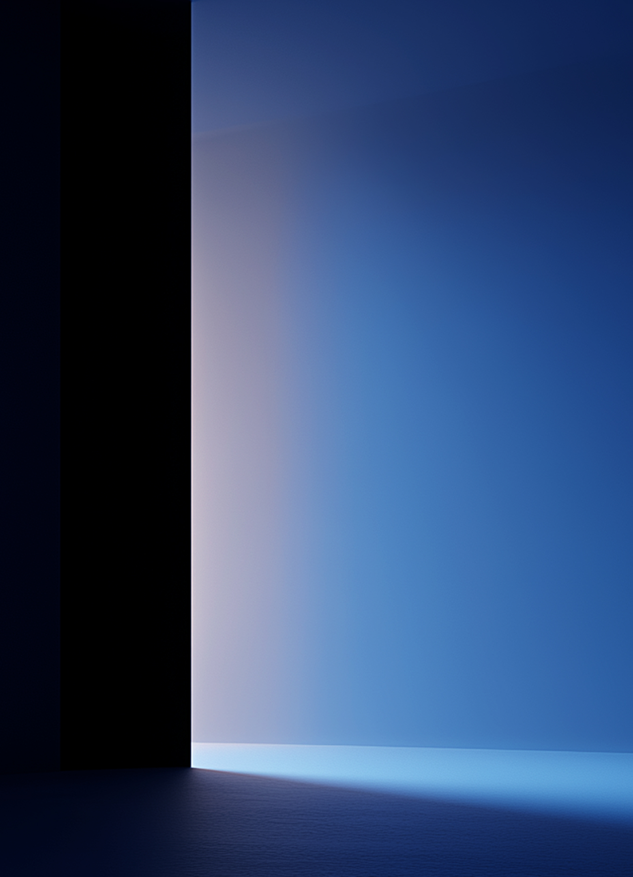 Light in shades of blue and soft white streaming through a doorway into a dark room, illuminating the floor and wall.