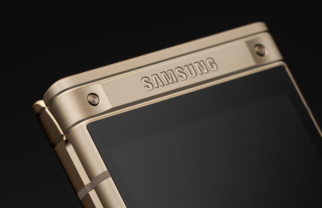 A detail shot of the gold W2018 is seen.