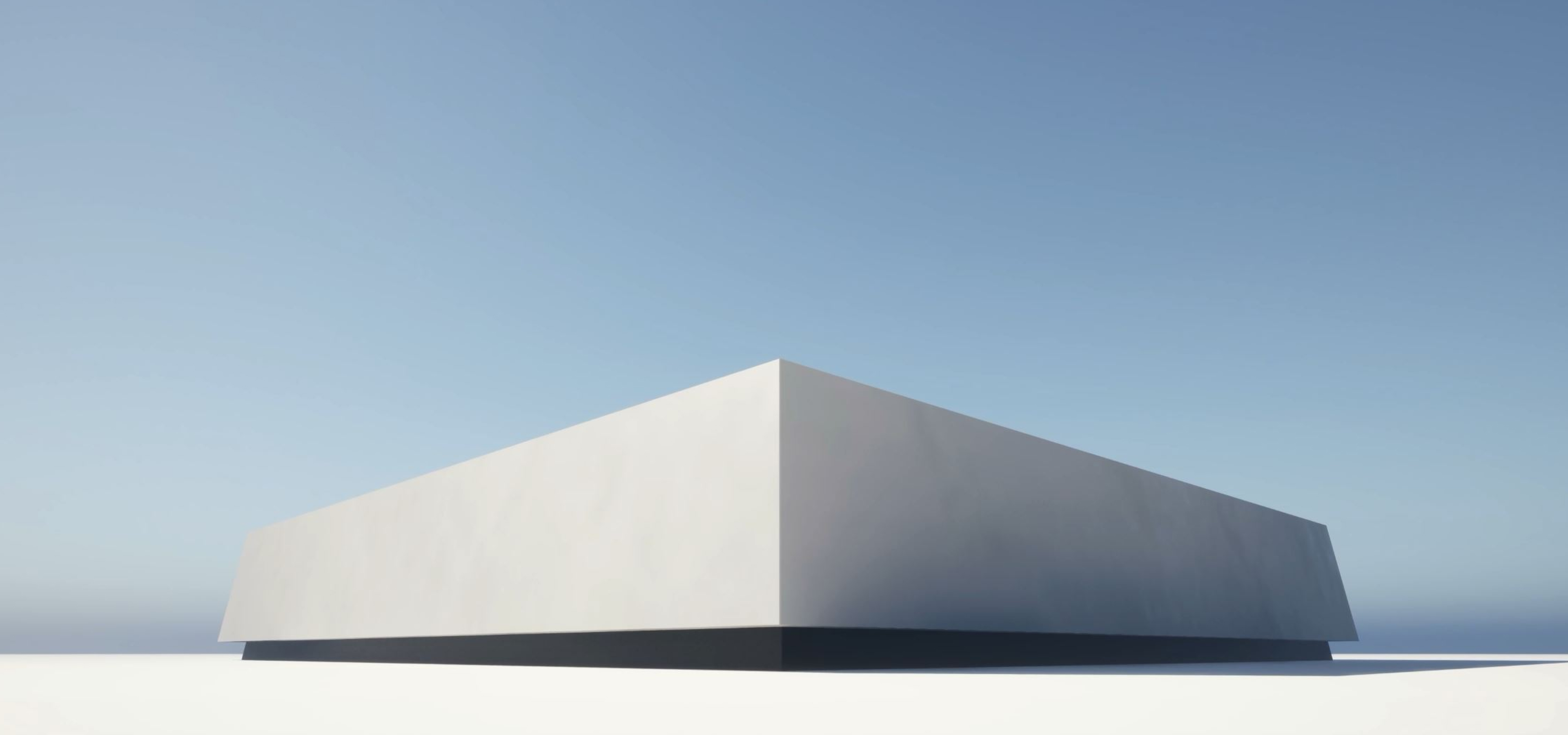 A clean, rectangular building sits on a flat white surface under a wide, clear sky.