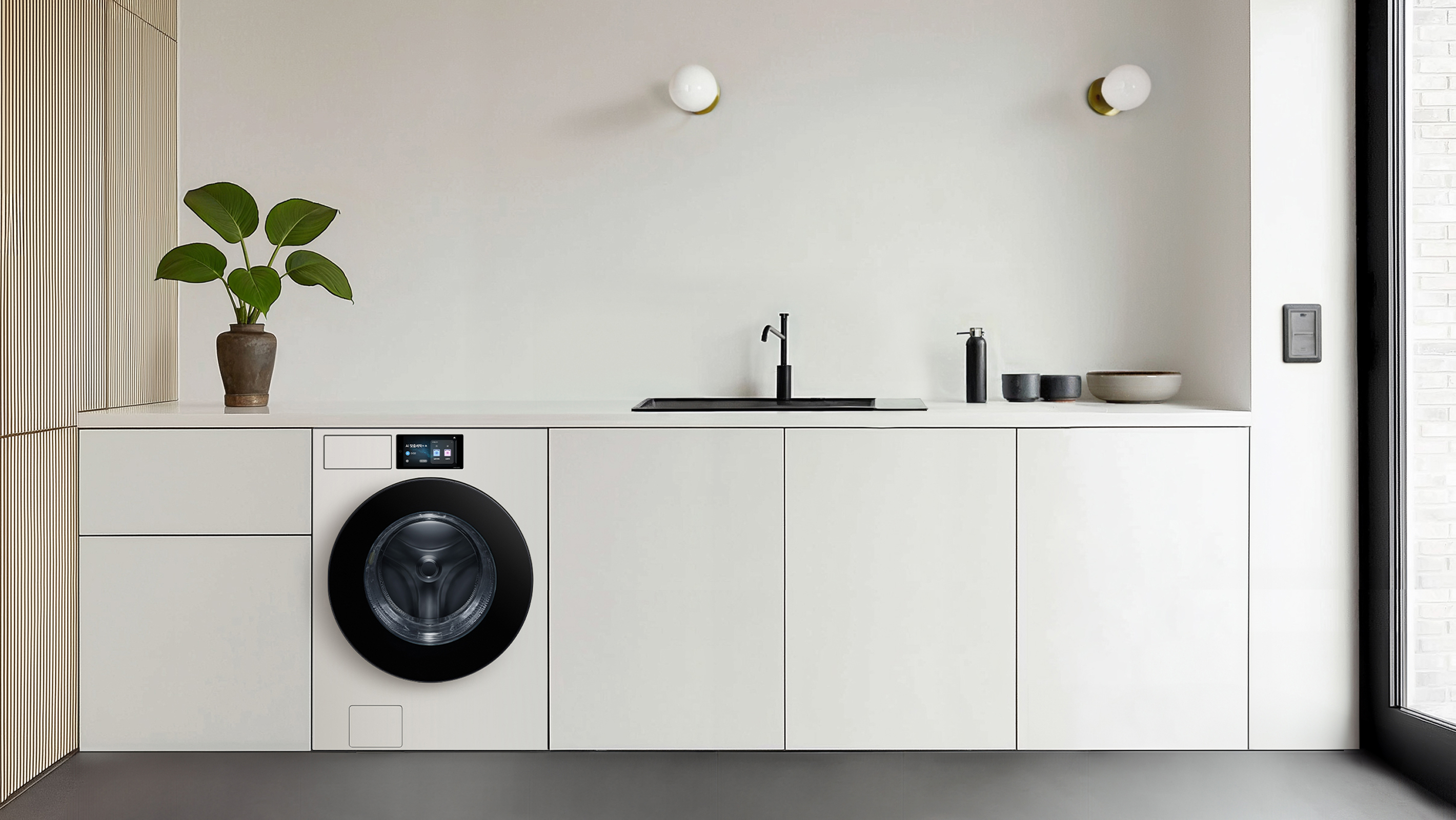 A front-load washer with a clean, built-in display is seamlessly integrated into a minimalist white kitchen interior.