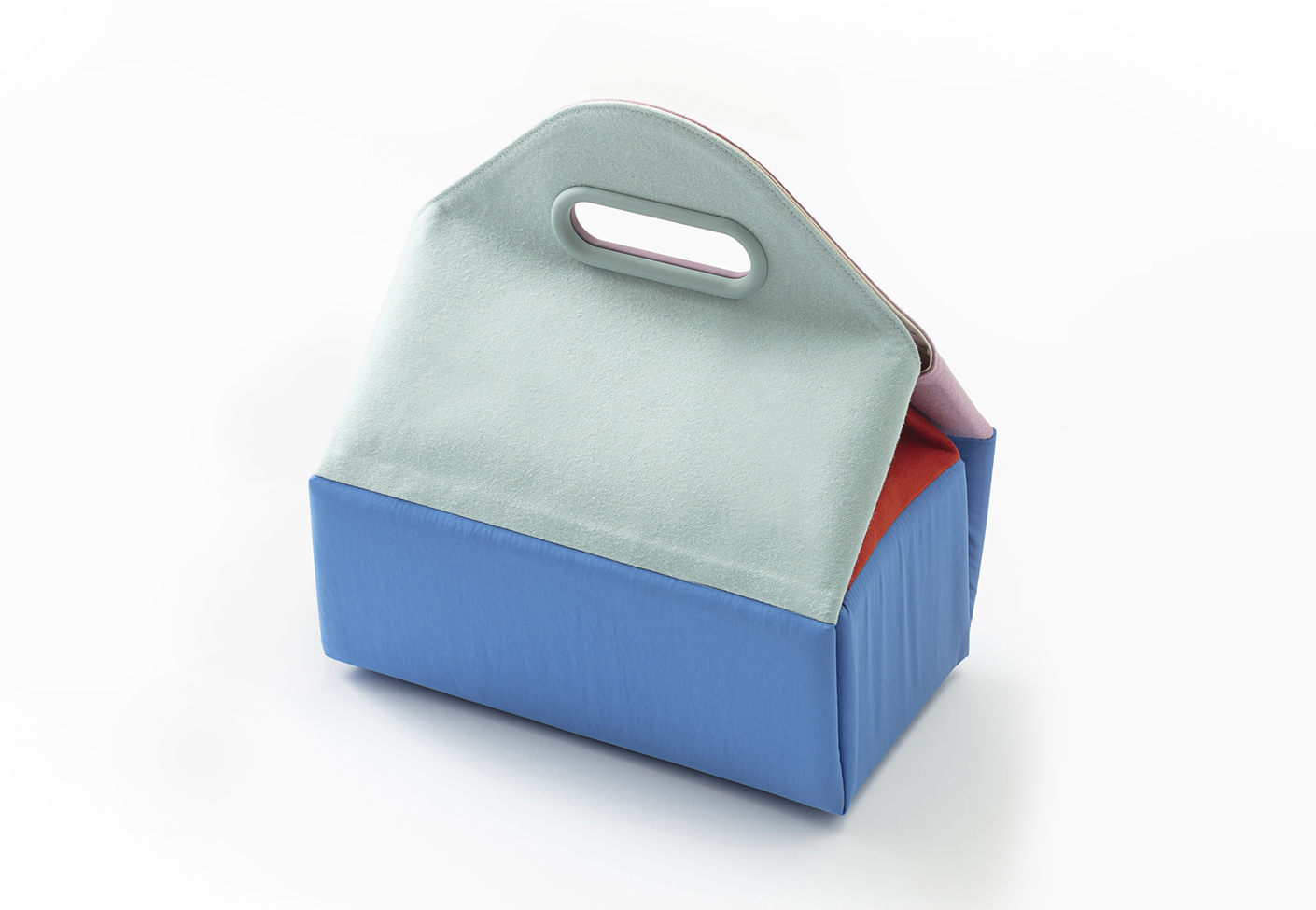 A compact portable device wrapped in a bojagi. The handle resembles a roof, and the rectangular base evokes the shape of a house.