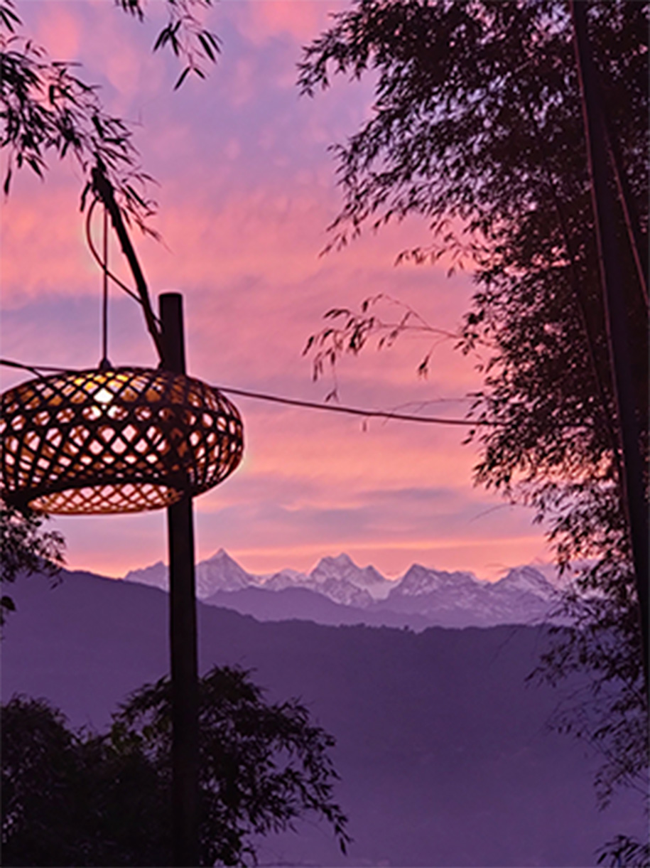 A distant image of the Himalayas at sunset.