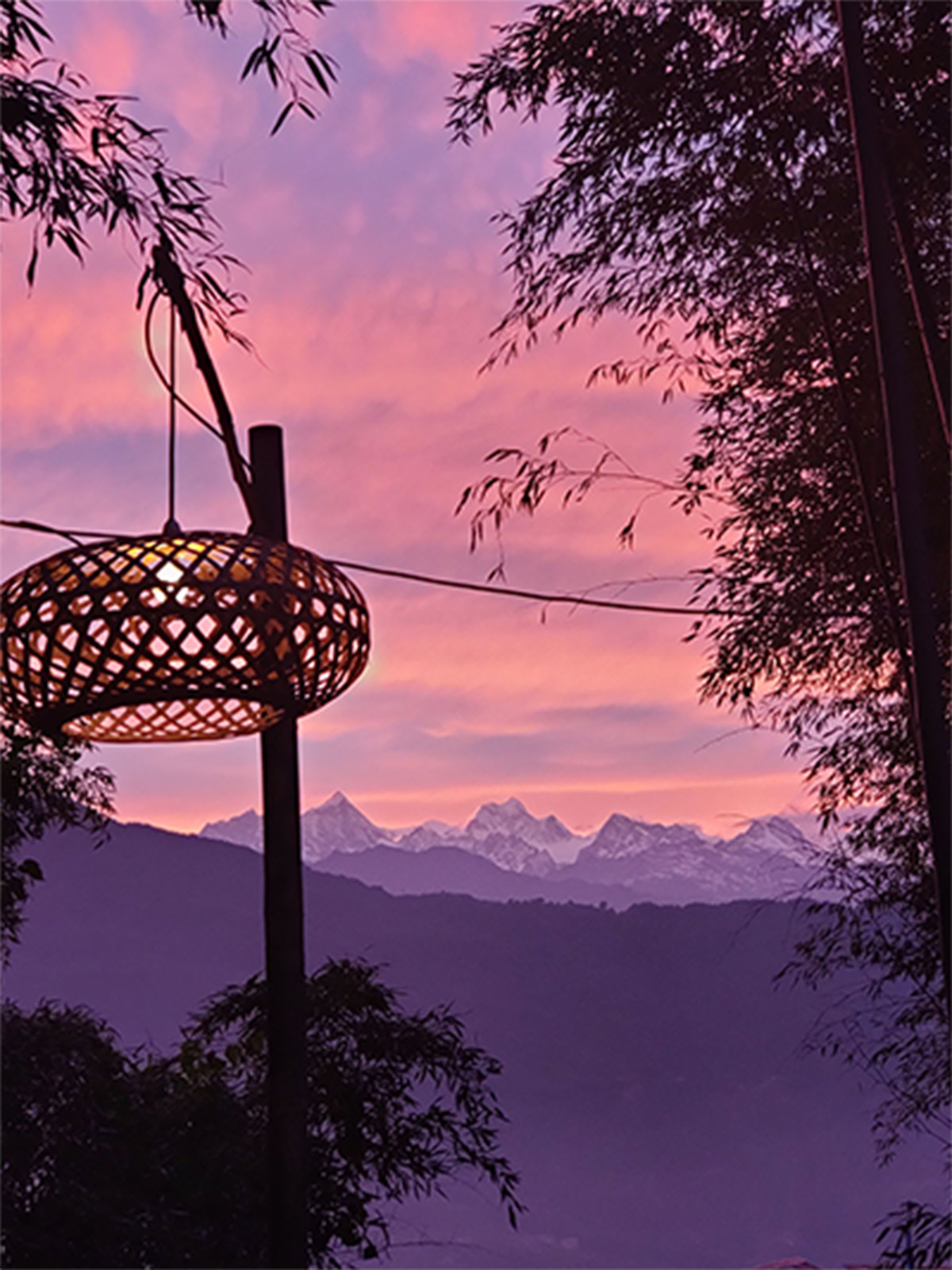 A distant image of the Himalayas at sunset.