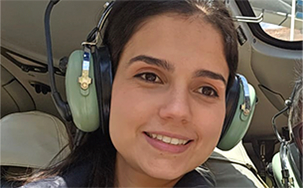 A selfie of a woman on a helicopter tour.