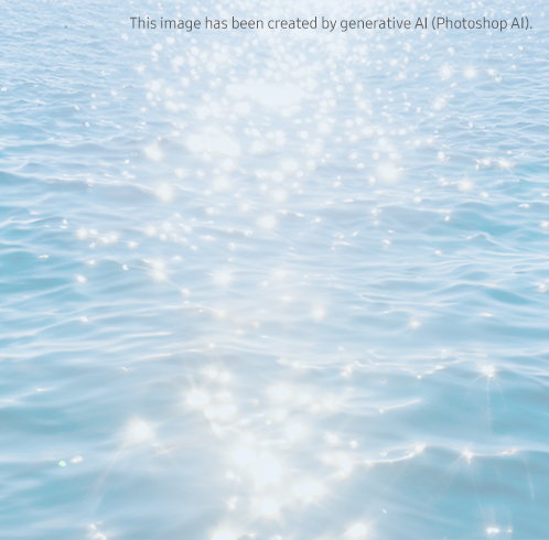 A wide-open Galaxy Z Flip 6 Blue with the camera visible, and a Z Flip 6 Blue in front of it, open at ninety degrees, showing the wallpaper screen. The product background is an image of Light reflected in blue waves with a shimmer. Background image has been created by generative AI (Photoshop AI).