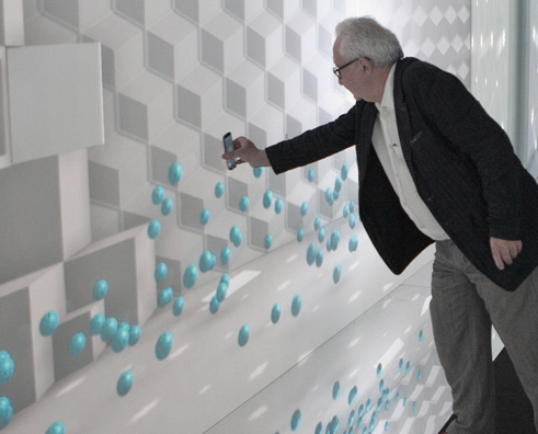 François Confino was holding up Samsung’s Galaxy S3 on the display to experience the exhibition. The specially-wrapped walls offered users the interactive experience to visitors.