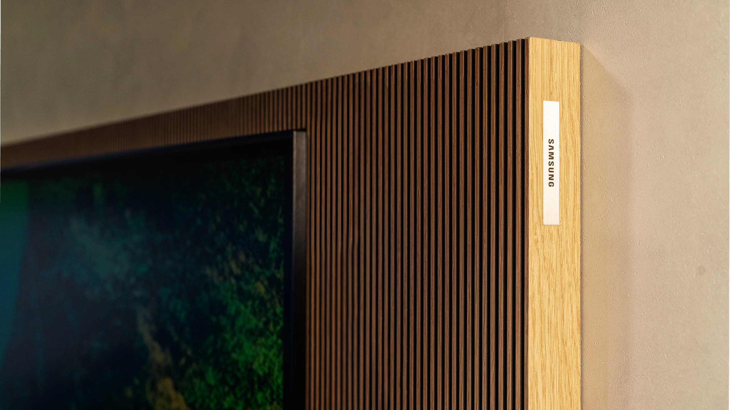 Refined wood frame detail of the 130-inch Micro RGB display.