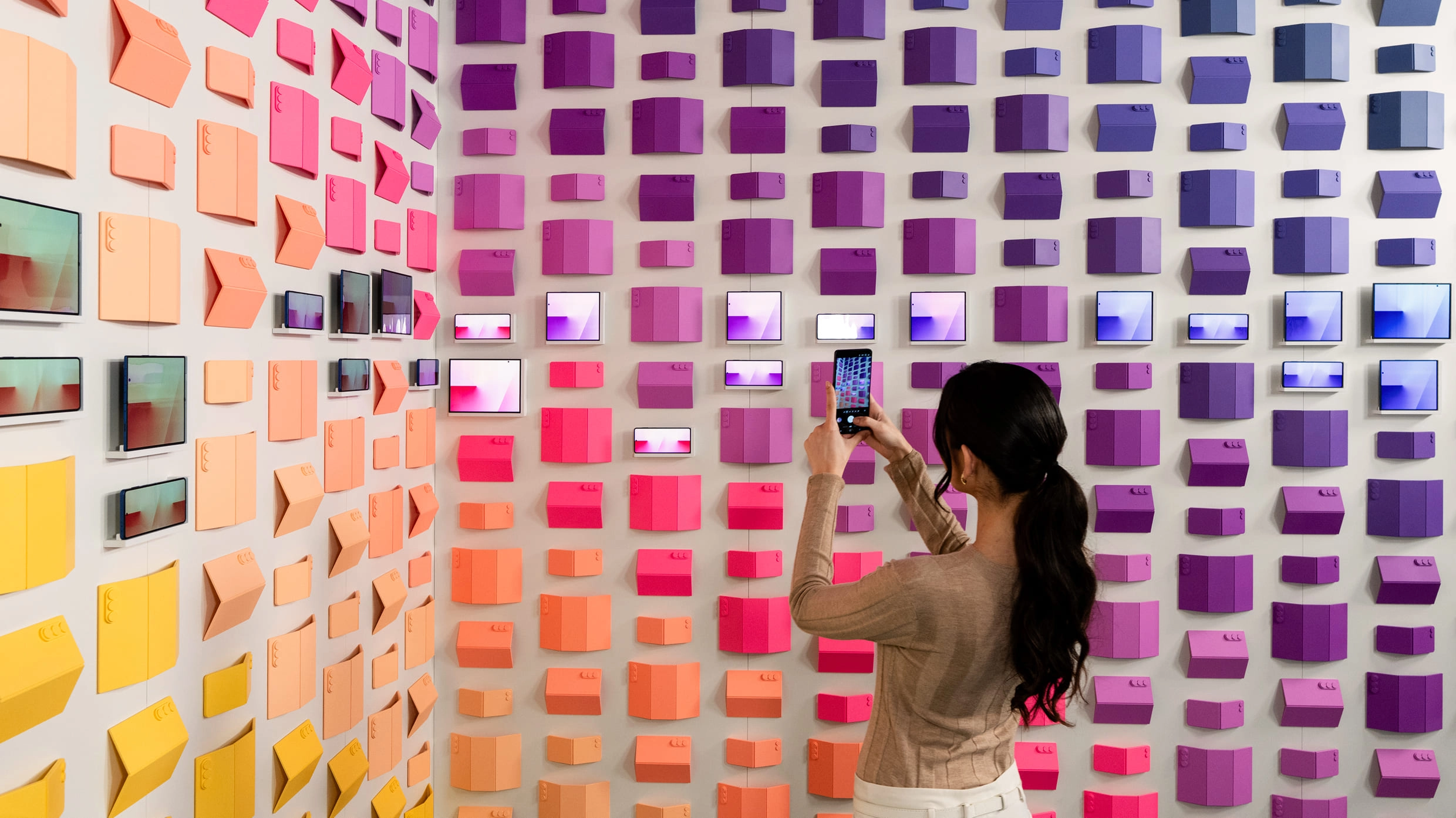 Visitors taking photos in the Unfold Your Story section.