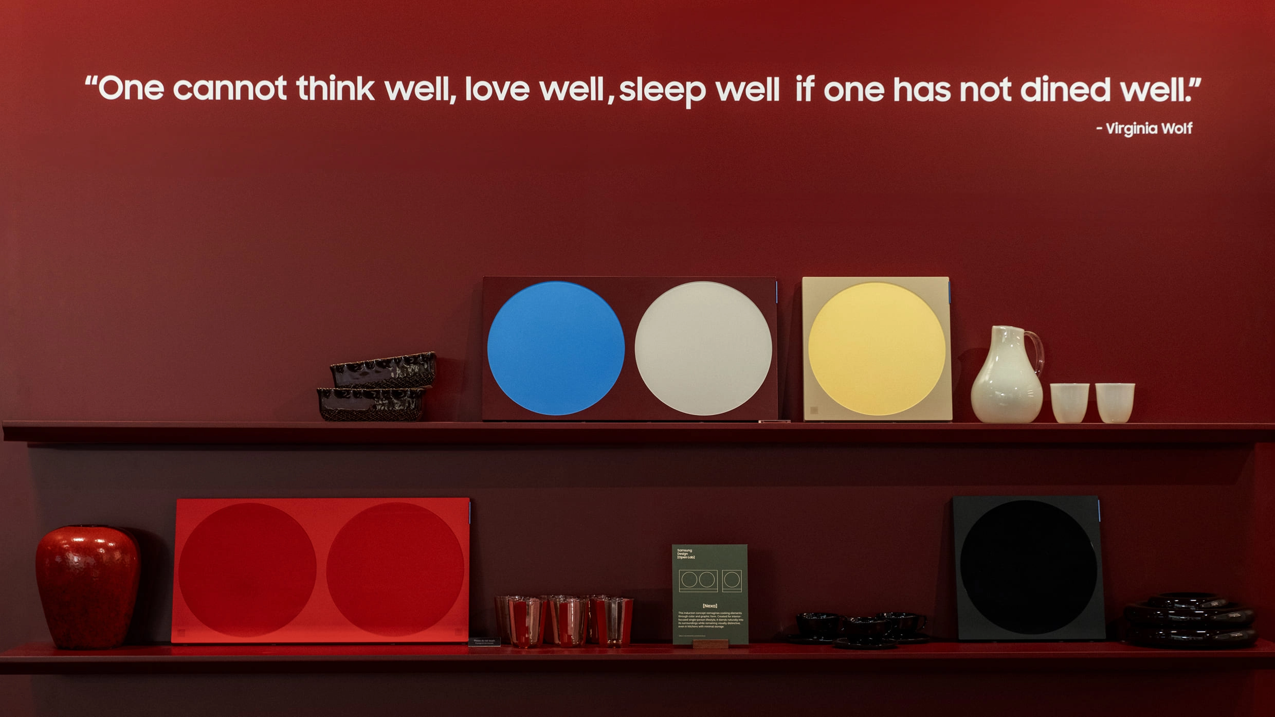 Quote displayed on a burgundy wall: “One cannot think well, love well, sleep well, if one has not dined well.” - Virginia Woolf.