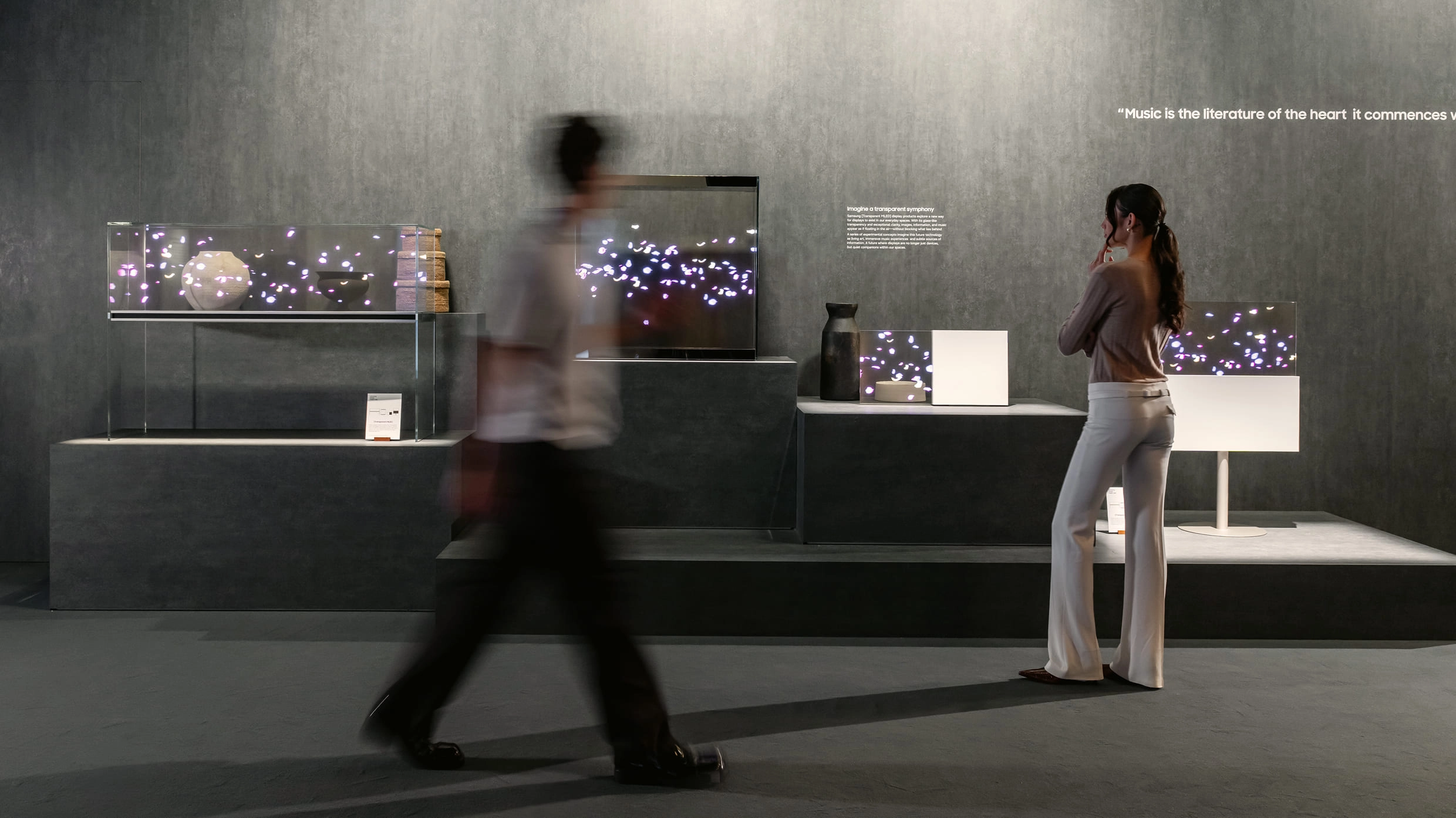 Transparent Symphony section featuring Samsung transparent MLED displays that appear to float in the air.