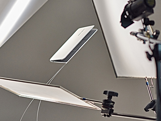 An image shows writer JaeYong Park immersed in his work.