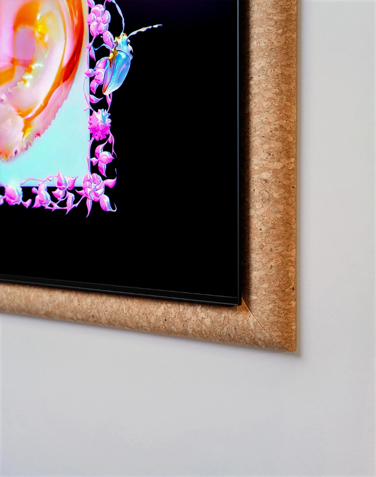 An OLED S95H TV with a black screen sits inside a brown speckled frame. On the screen, a shiny golden deer curls up asleep in a pale-blue space bordered by pink flowers.