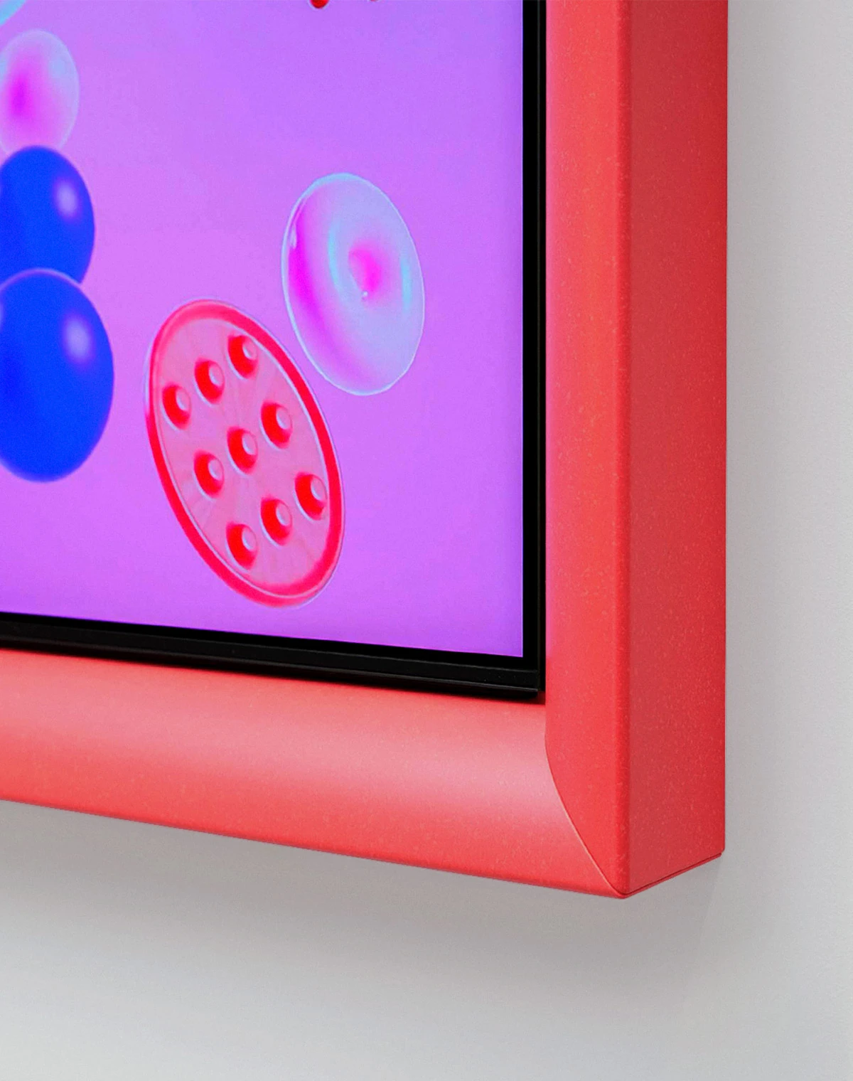 Inside a red frame, The Serif is centered on a pink screen. Blue rings and curved forms, along with pink cloud-like shapes, circles, and rectangles, are projected onto the screen or float around The Serif.