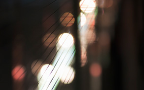 Futuristic&nbsp;metal wires with dramatic lights in the background.