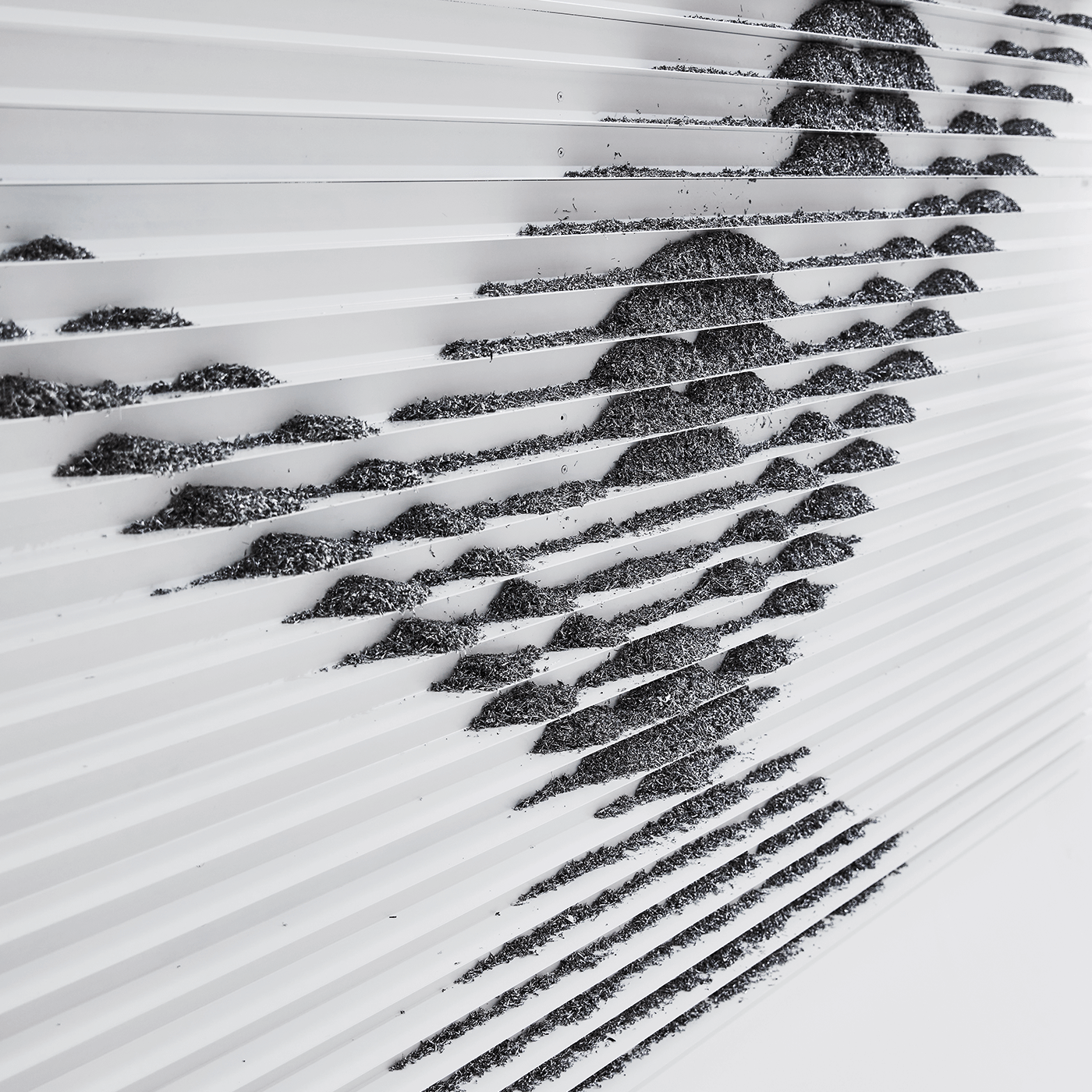 It's a detailed cut of ‘The Footprint’ made of aluminum.